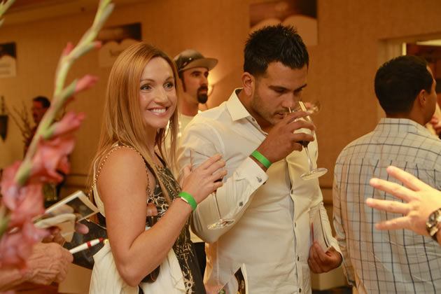 Guests Laura Hubbard and Steven Yee enjoy wine tastings and hors d’oeuvres at the sixth annual Vino de Sueños Release Celebration on November 2.