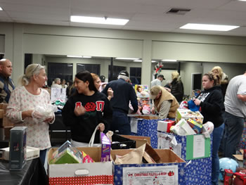  People Helping People volunteers begin set-up of the 2012 Fulfill-A-Wish Boutique in space donated by the owners of Denmarket Square in Solvang. The 2013 version of the boutique will be established at Valley Station in Buellton.