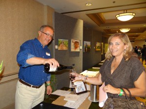 Michael Meluskey pours Qupé 2011 Syrah for Ana D’Arace at the 7th Annual Vino de Sueños Wine Release Celebration.