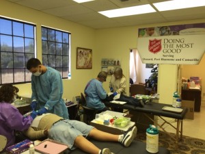 Drs. Luz Cubillo (left) and Shultz furnish fluoride varnishes and sealants to children during a free dental clinic at People Helping People in Solvang on Saturday, May 16th.