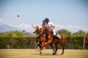 Andy Busch of The Masters rides stride for stride with Jesse Bray of Team U.S.A. during the featured match at the 4th Annual Polo Classic.